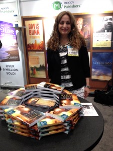 Books & Such author Tessa Afshar signing books in the Moody Publishers booth.