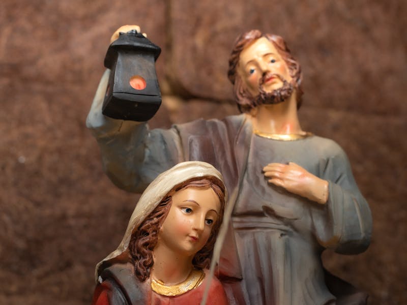 A detailed sculpture depicting the Holy Family in a nativity scene with serene expressions and lifelike details.